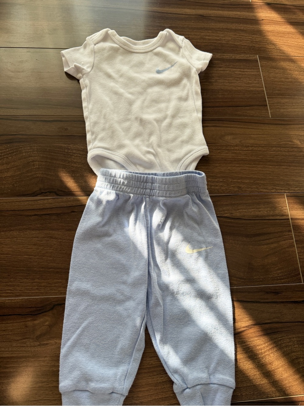 Nike Light Blue Jogger Pants with White Bodysuit - Kids